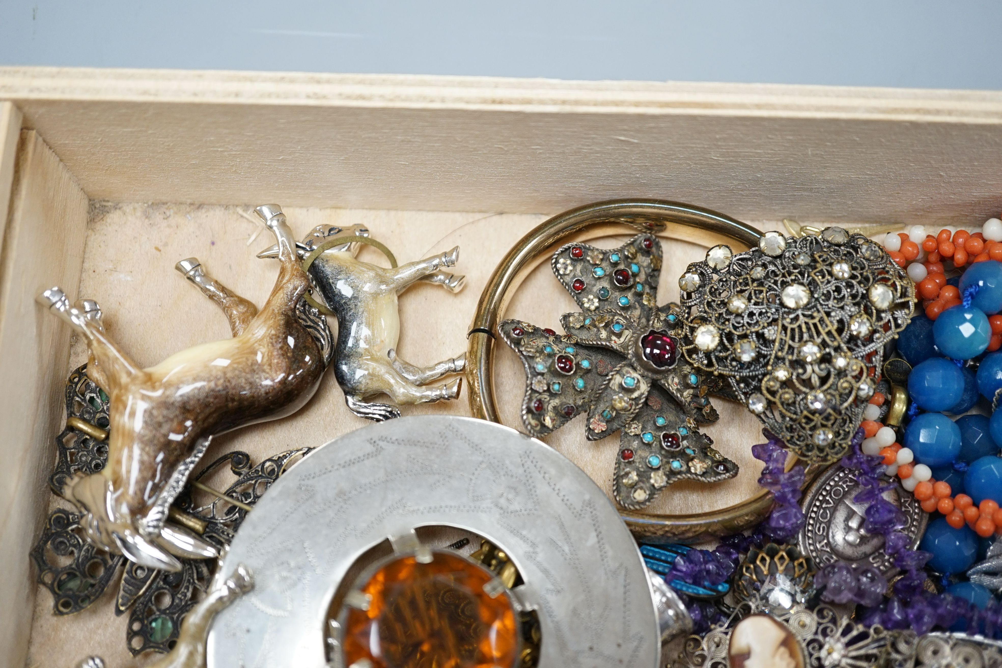 A group of assorted mostly costume jewellery including a Scottish brooch